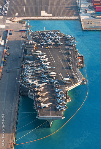 Aerial view aircraft carrier park for loading oil from tanker ship at port.
