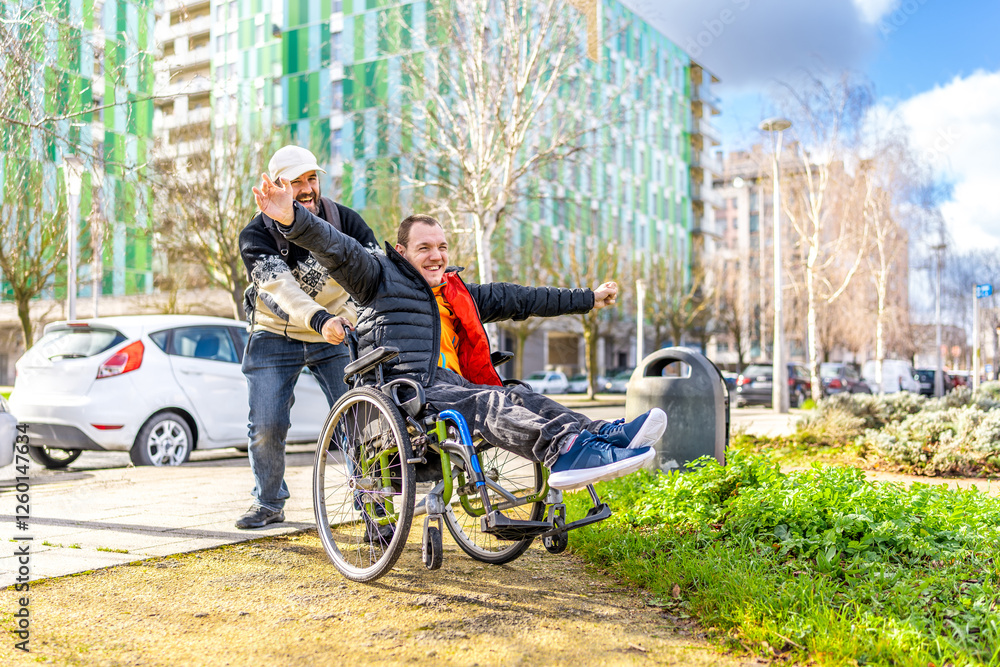 Caregiver pushing happy disabled man in wheelchair, having fun outdoors Caregiver pushing happy disabled man in wheelchair, having fun outdoors