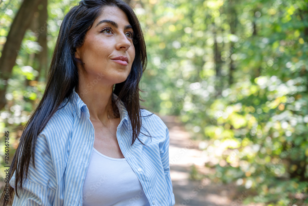 Beautiful woman relaxing in the summer park Beautiful woman relaxing in the summer park