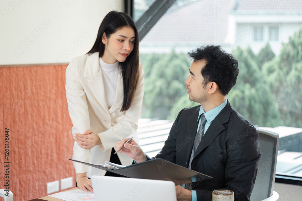 Business team reviewing financial data and strategies in a modern workspace. Business team reviewing financial data and strategies in a modern workspace.