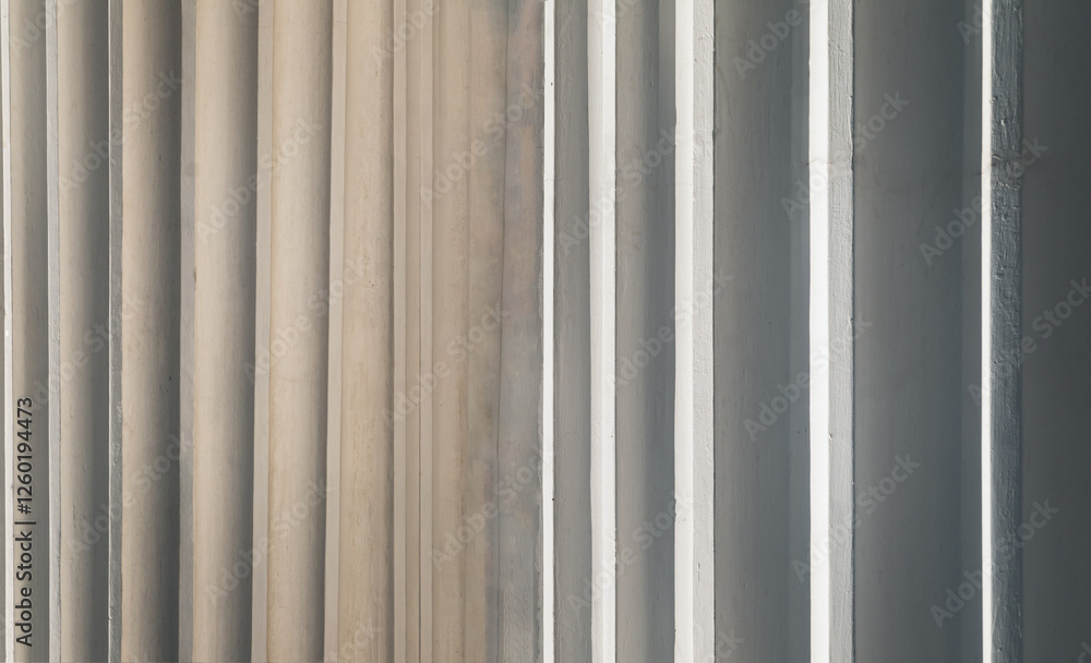 Sunlight shines passing through light channel of exterior of the concrete white walls background. use it as your Space for text, Design, Wallpaper and Poster, Selective focus.
