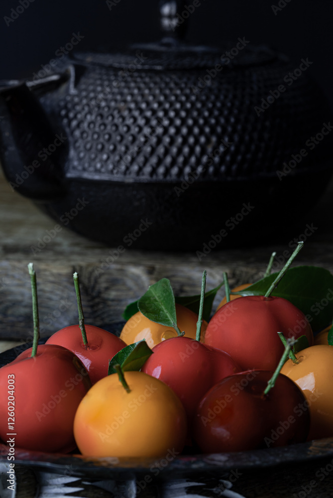Colorful deletable imitation fruits (Kanom look choup) in the shape of oranges, rose apple and strawberries has a sweet taste. Traditional thai sweet treats made from mung beans and coconut milk.
