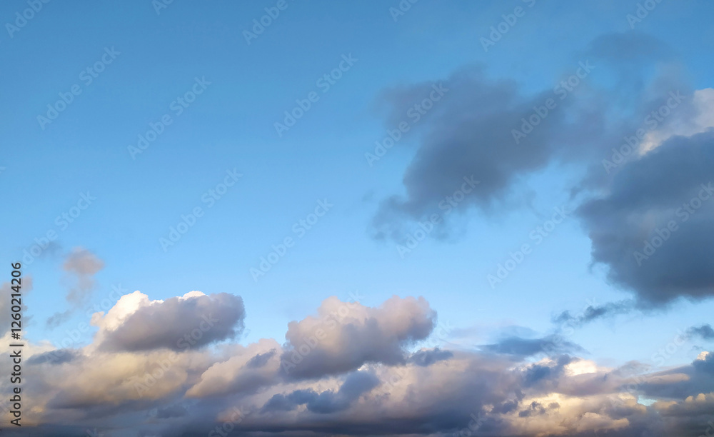 Clear blue sky texture and white fluffy cloud nature background. The sun shines bright in the daytime in summer Clear blue sky texture and white fluffy cloud nature background. The sun shines bright in the daytime in summer
