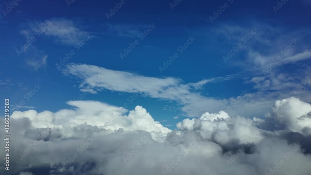 POV flying through a stormy sky through the pilot’s eyes under a blue sky full of storm clouds. Aerial footage taken from a jet cockpit. 4K 60FPS POV flying through a stormy sky through the pilot’s eyes under a blue sky full of storm clouds. Aerial footage taken from a jet cockpit. 4K 60FPS