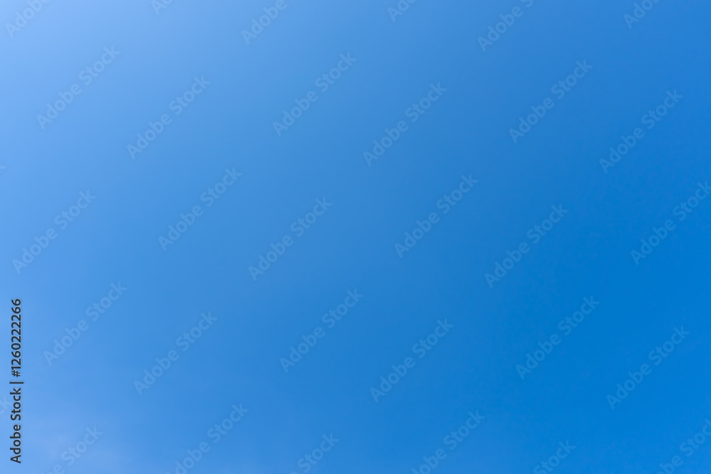 Low angle view and full frame of beautiful light blue sky without clouds in the morning or afternoon on sunny day used as natural background texture in decorative art work. Low angle view and full frame of beautiful light blue sky without clouds in the morning or afternoon on sunny day used as natural background texture in decorative art work.