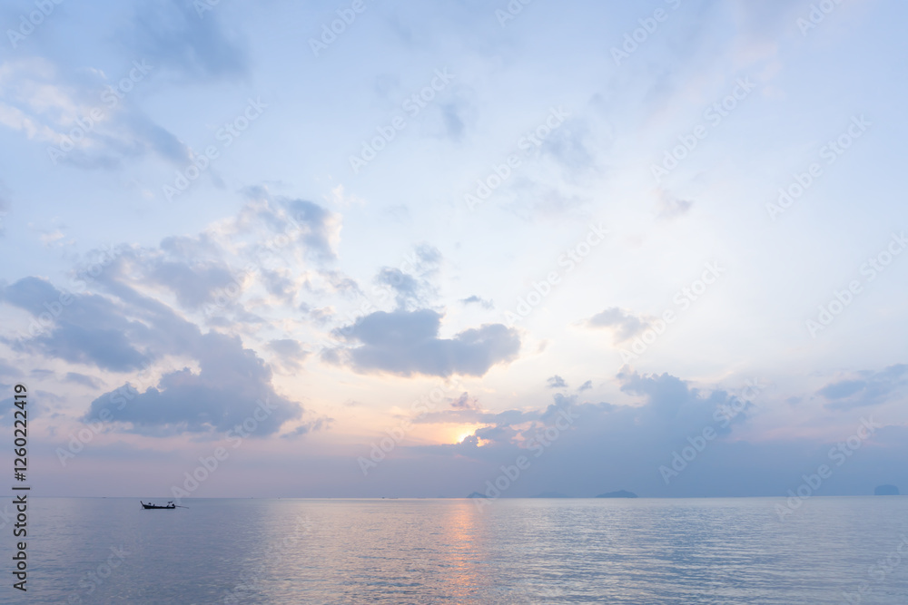 Beautiful morning or evening blue and orange sky with cloudy while sunsets or sunrises taken at the sea beach is used as natural blackground texture Beautiful morning or evening blue and orange sky with cloudy while sunsets or sunrises taken at the sea beach is used as natural blackground texture