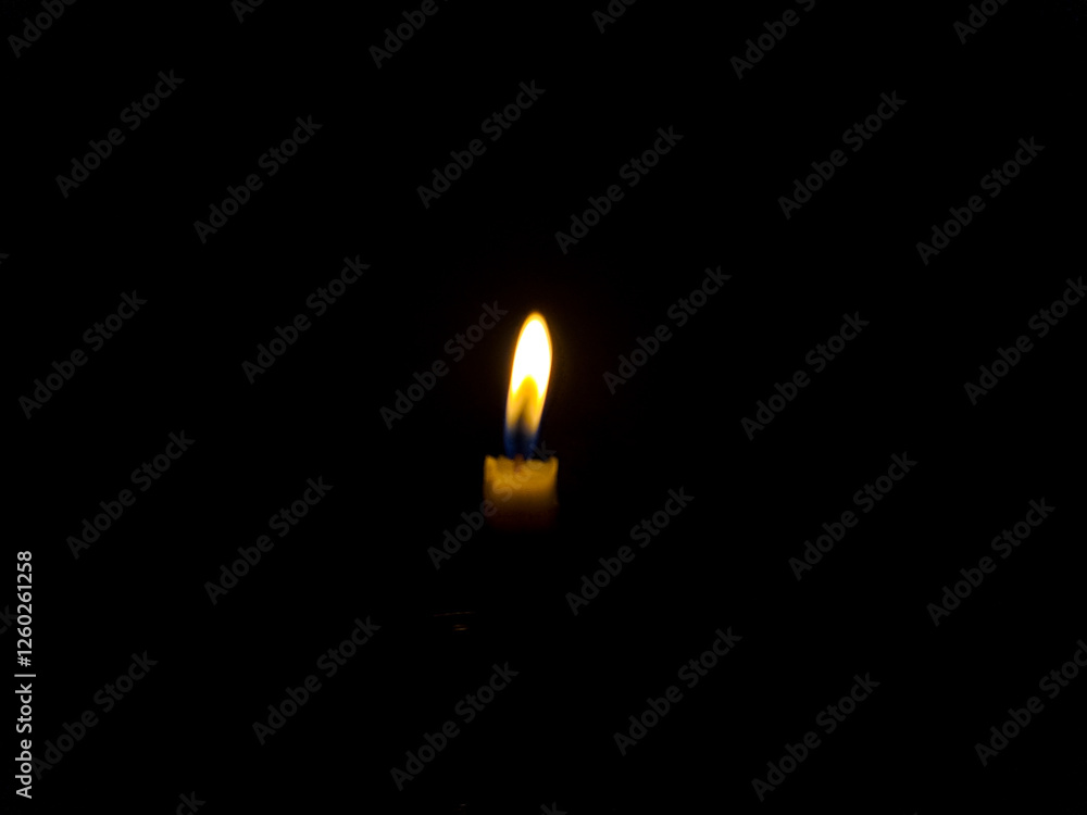candle in the dark. One light candle burning brightly on a black background.
candle in the dark. One light candle burning brightly on a black background.
