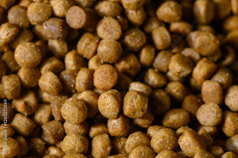 Nourishing pet food pellets in a close-up view showcasing their texture and color variations Nourishing pet food pellets in a close-up view showcasing their texture and color variations