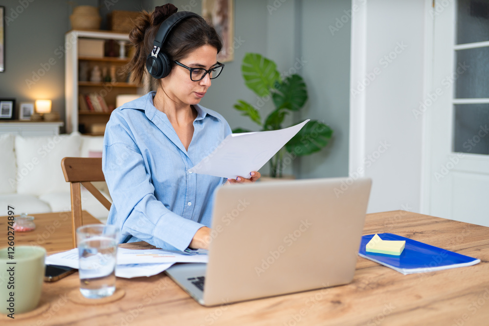 Finance and economy. Young woman, small business owner, working online at home office, preparing for video call for presentation and online coaching. E-commerce professional occupation freelance work Finance and economy. Young woman, small business owner, working online at home office, preparing for video call for presentation and online coaching. E-commerce professional occupation freelance work