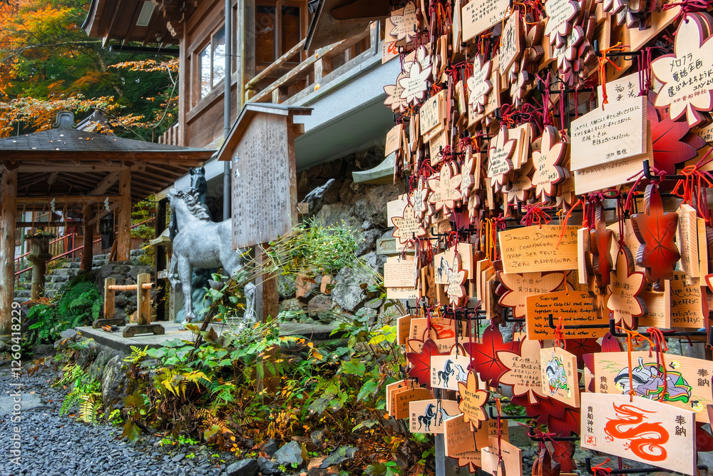 Fototapeta premium Kifune Shrine in Kyoto, Japan with beautiful autumn scenery. The shrine is dedicated to the god of water and rain and believed to be the protector of those at sea