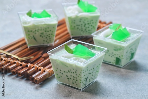 Buko Pandan is a Filipino made with green jelly cubes,  tapioca pearls, young coconut in a pandan infused cream. Suitable to be served for breaking the fast in Ramadan

