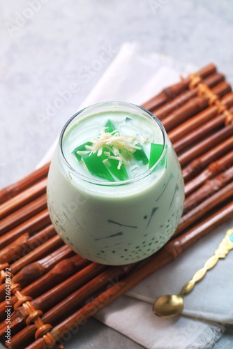 Buko Pandan is a Filipino made with green jelly cubes,  tapioca pearls, young coconut in a pandan infused cream. Suitable to be served for breaking the fast in Ramadan
