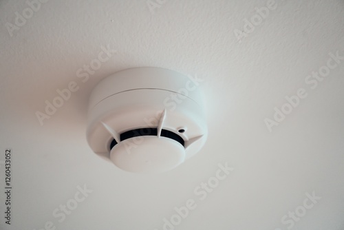 Ceiling-Mounted Smoke Detector for Fire Safety photo