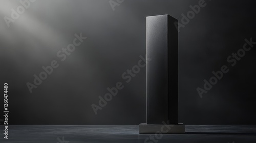 A bold monolithic trophy crafted from matte gunmetal with clean lines