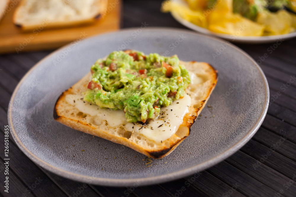 Morning toast with melted cheese and guacamol Morning toast with melted cheese and guacamol