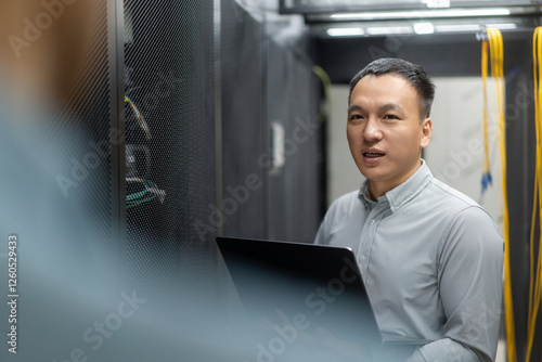 Wallpaper Mural asian engineer working in database Torontodigital.ca