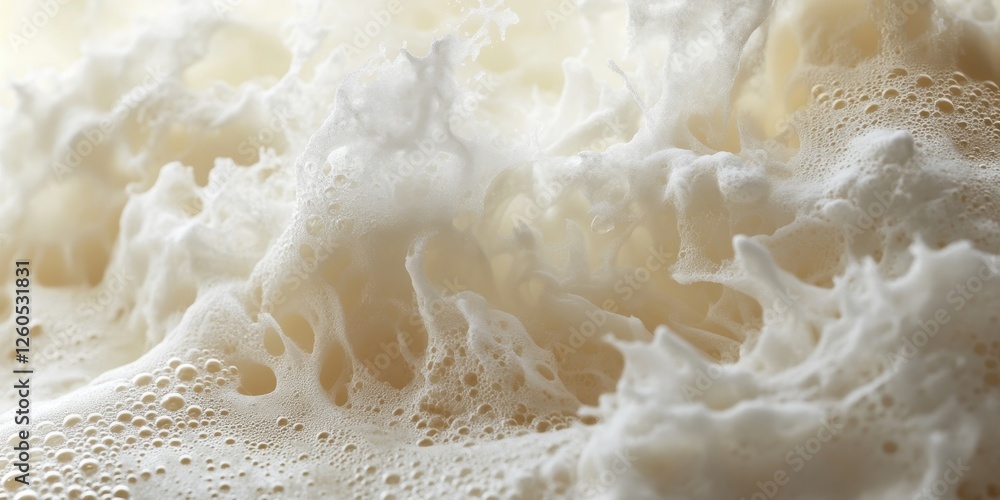 Foamy and creamy texture of freshly brewed beverage in close-up view captures the essence of warmth and comfort in a cozy setting Foamy and creamy texture of freshly brewed beverage in close-up view captures the essence of warmth and comfort in a cozy setting
