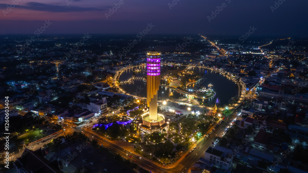 Obraz premium Aerial view Roi et tower or Vote Tower 101 and Bung Plan Chai This park in the middle of Roi Et's lake in the city center nighttime ,Province Roi Et Thailand.