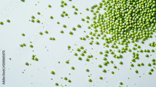 Scattered green peas on white background photo