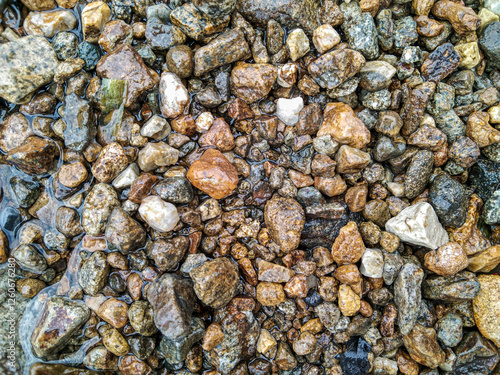 Piles of small river rocks give a natural and simple impression