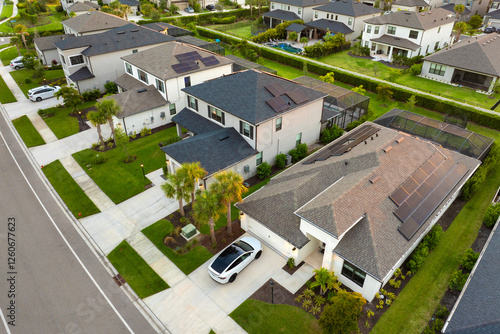 Fototapeta Naklejka Na Ścianę i Meble -  Aerial view of expensive residential houses in small town in southwest Florida. American dream homes as example of real estate development in US suburbs