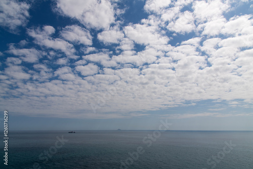 tranquil seascape with clouds and sea photo