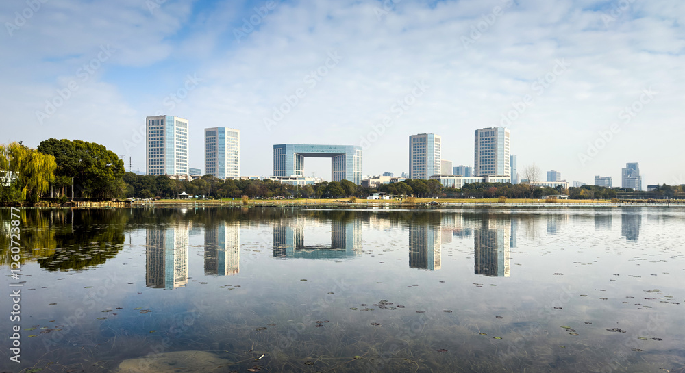 Serene Urban Landscape: Reflections of Modern Architecture in Tranquil Waters Serene Urban Landscape: Reflections of Modern Architecture in Tranquil Waters