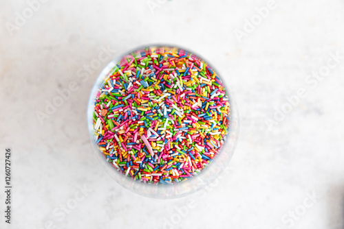 Colourful sugar sprinkles in a bowl photo