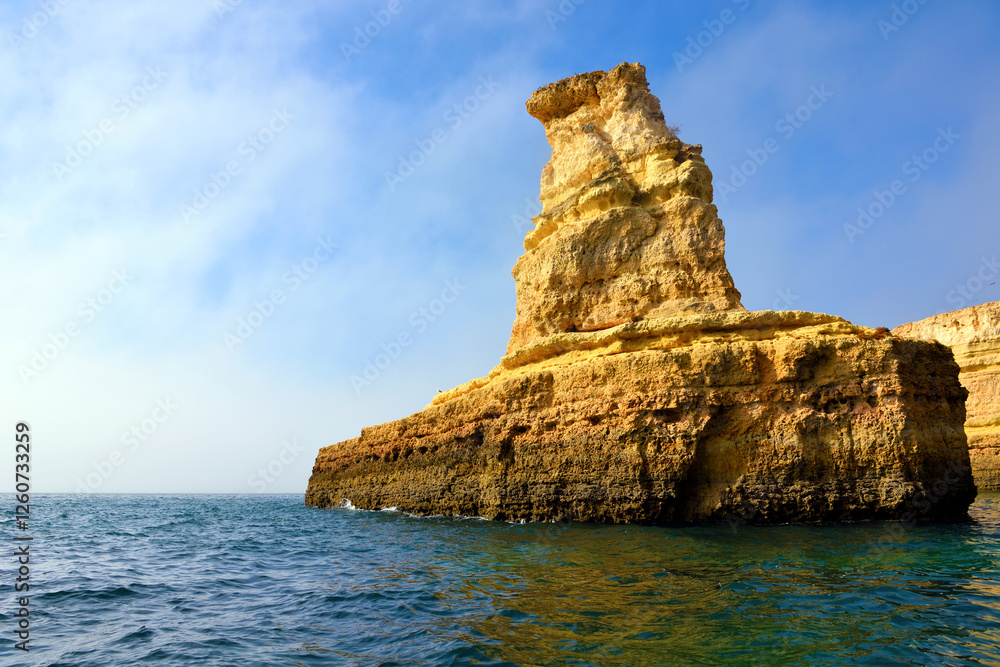 The Algarve Yellow Submarine Rock Formation is a unique and stunning natural wonder located in the coastal town of Porches Portugal The Algarve Yellow Submarine Rock Formation is a unique and stunning natural wonder located in the coastal town of Porches Portugal