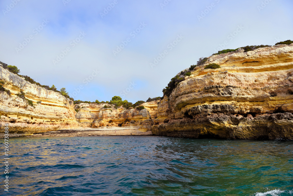 The Algarve Rocks Formation is a unique and stunning natural wonder located in the coastal town of Porches Portugal The Algarve Rocks Formation is a unique and stunning natural wonder located in the coastal town of Porches Portugal