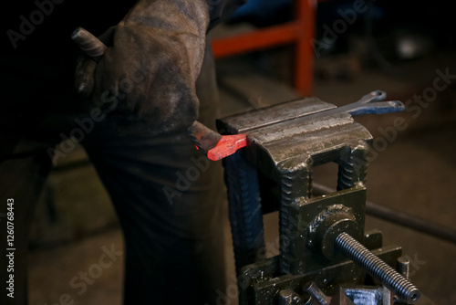  Close-up of a blacksmith working on a metal construction