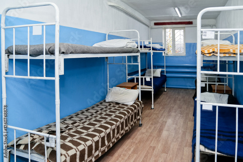 Obraz na płótnie Interior of a prison cell with bunk beds and bunk beds w salonie