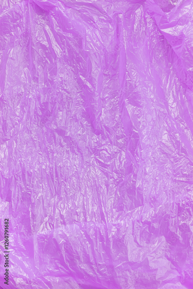 Fototapeta premium Crumpled purple plastic texture background.