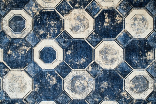 Elegant geometric patterns in deep blue and cream create a captivating visual experience on a textured surface