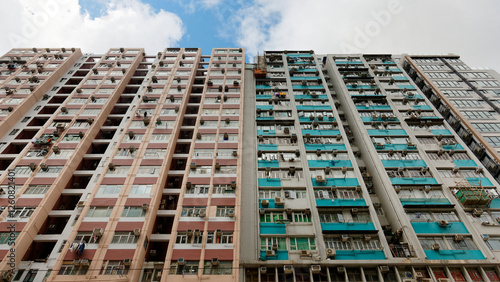 Wallpaper Mural Low angle view of high-rise residential towers with crowded narrow apartments in a community near Tin Hau MRT Station, in Hong Kong, a phenomenon of severe housing shortage due to overpopulation in HK Torontodigital.ca