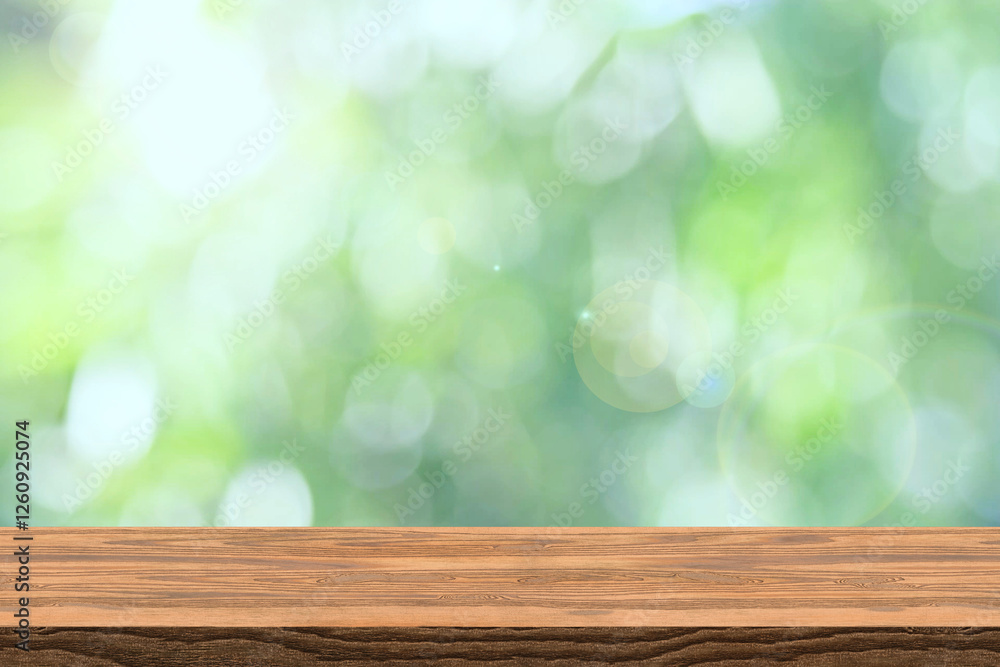 Abstract blurred green bokeh and brown wooden tabletop texture perspective counter for promoting and advertising product on display Abstract blurred green bokeh and brown wooden tabletop texture perspective counter for promoting and advertising product on display