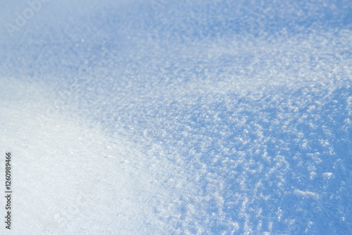 blue snow background in sunny winter day