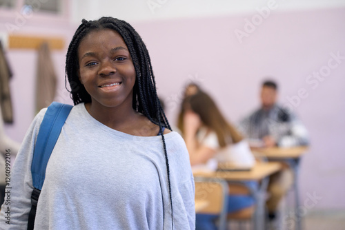 Tableau sur toile Smiling black student girl standing in classroom at institute