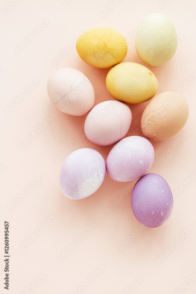 Natural dying Easter eggs on peach background. Easter greeting card. Natural dying Easter eggs on peach background. Easter greeting card.