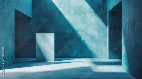 In a serene studio illuminated by soft shafts of light, bold geometric shapes emerge from a calming blue backdrop. The play of shadow and light creates a tranquil yet dynamic ambiance photo