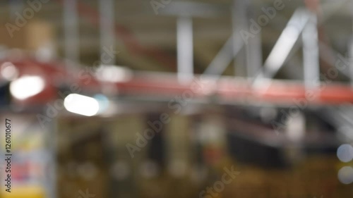 Wallpaper Mural Blurred Warehouse Conveyor System with Moving Packages Torontodigital.ca