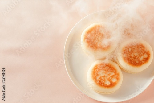 Freshly Baked Welsh Cakes on a White Plate With Steam Rising Against a Soft Beige Background