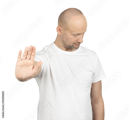 Serious bald man making a stop hand gesture