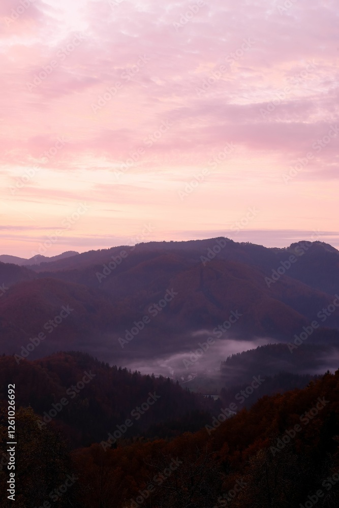 Serene mountain sunrise with mist and pink clouds. Serene mountain sunrise with mist and pink clouds.