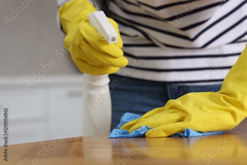 Wallpaper Mural Woman using cleaning product while wiping wooden table with rag indoors, closeup Torontodigital.ca