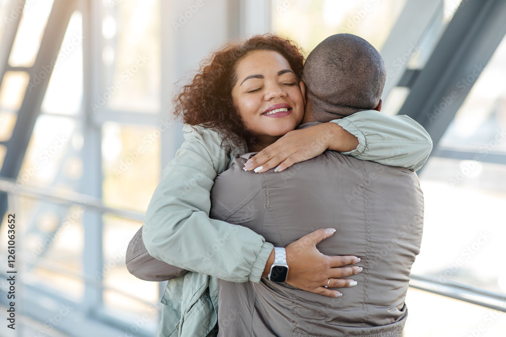 Welcome back. Happy african woman embracing her loving boyfriend, free space. High quality photo Welcome back. Happy african woman embracing her loving boyfriend, free space. High quality photo