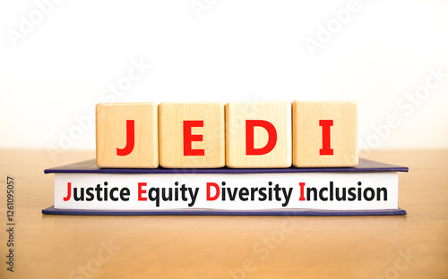 Justice equity diversity inclusion symbol. Concept words JEDI Justice Equity Diversity Inclusion on blocks. Beautiful white background. Business justice equity diversity inclusion concept. Copy space photo