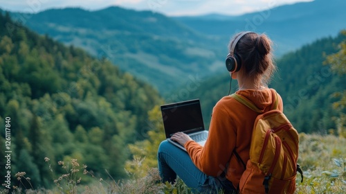 Wallpaper Mural Woman working remotely on a laptop with scenic mountain backdrop Torontodigital.ca