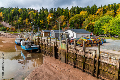 A view along the harbour wall at low tide at Vaughan Creek, New Brunswick in the fall photo