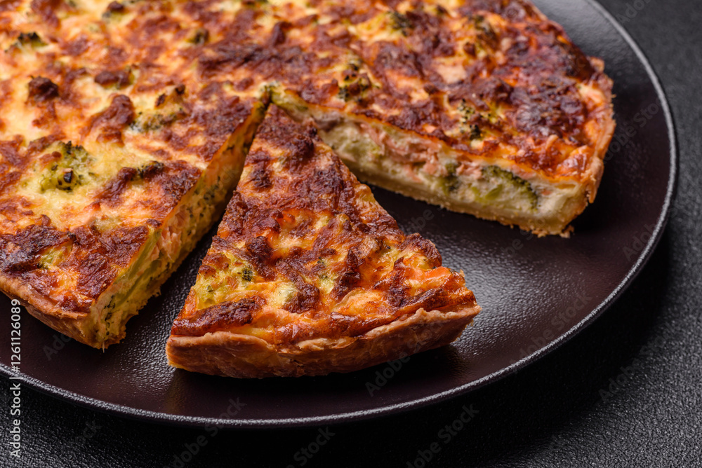 Delicious fresh quiche with broccoli, cheese, spices and herbs Delicious fresh quiche with broccoli, cheese, spices and herbs